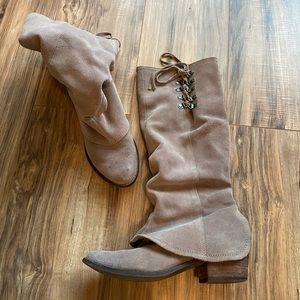 Women's tall, lace up boots.